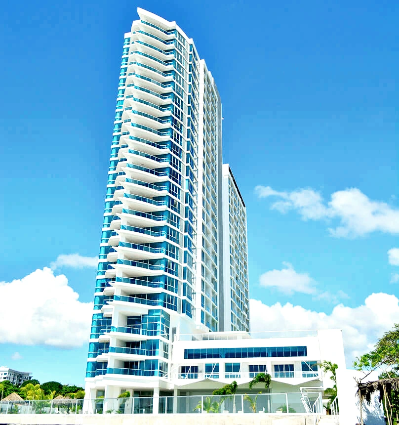 Curved white balconies stack up Royal Palm's tower like a ship's hull